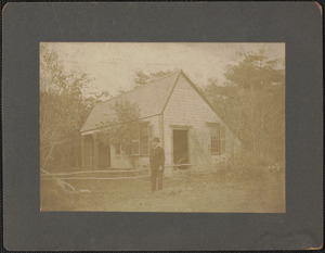 Man in front of barn