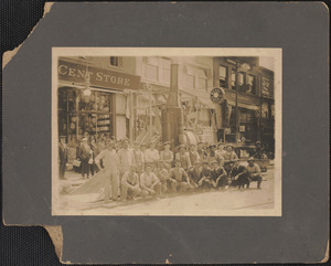 Workers on a street with large machine