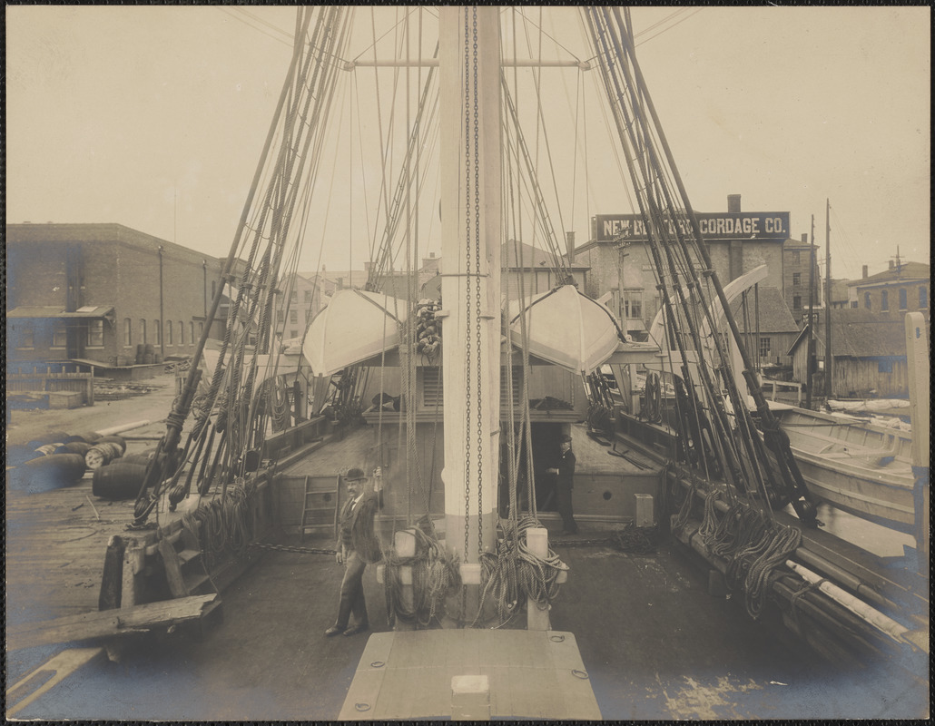 Man on deck of docked whaling ship