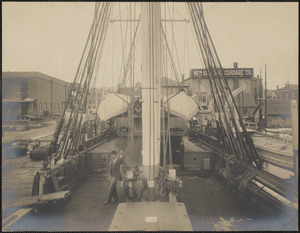 Man on deck of docked whaling ship