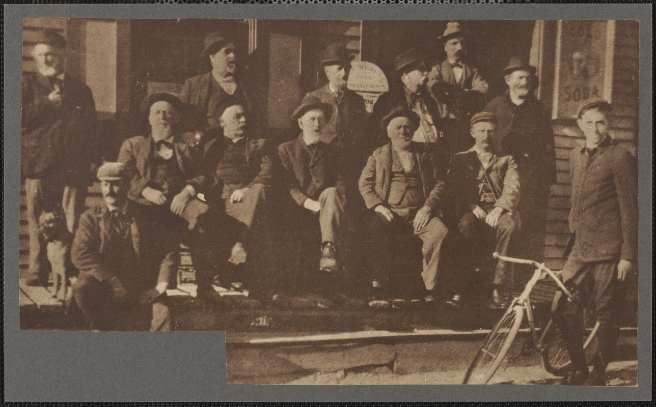 Group of men, most elderly and bearded, wearing hats, seated and ...