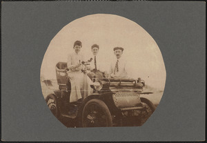 In 1903, the late Edgar W. Russell of Fairhaven is shown standing beside this ancient gas chariot while in the seat are, left, Lucy Allen, now Mrs. Ernest Query, and Edith Allen, now Mrs. Harold Coxen