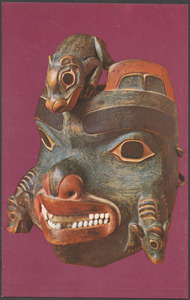 Carved wooden mask with animals
