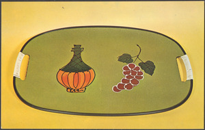 A green tray with an image of a Chianti bottle and a bunch of grapes