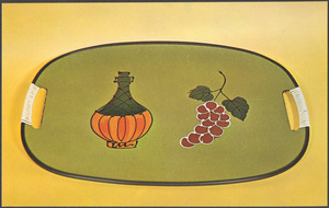 A green tray with an image of a Chianti bottle and a bunch of grapes