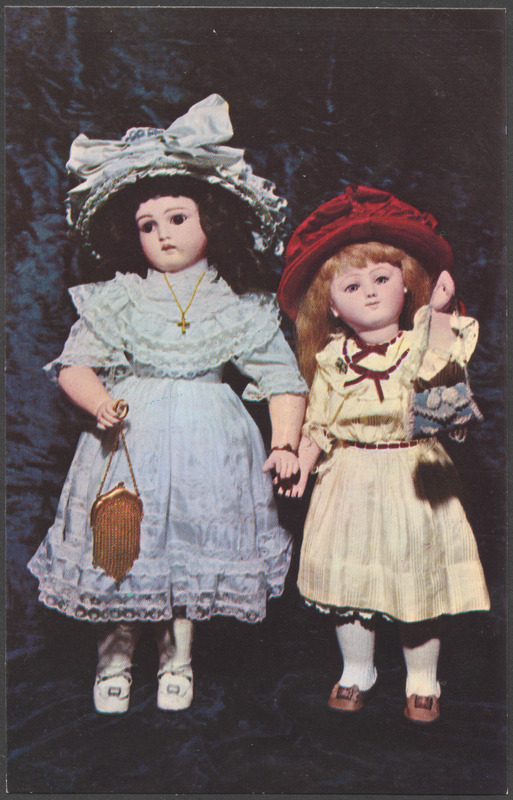 Left, fine, French Belton doll - jointed body - ice pale blue silk and lace outfit. Right, closed-mouth French Steiner doll - dressed in cream, with garnet velvet ribbon trip and felt hat