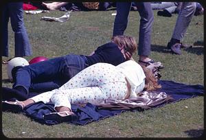 People lying in grass in park, possibly Boston Common