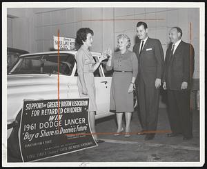 Mrs. Samuel Gorsky of Brookline, second left, gets keys for ’61 Dodge Lancer she won in contest sponsored by Greater Boston Assn. for Retarded Children. Others from left are Mrs. Jerome Sapherstein of the association, and Herbert A. Abramson and Lewis Kurland, president and sales manager, respectively of Silver Lake Motors, Newton, who donated car. Contest raised $10.000 for retarded youngsters.