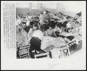 Evacuated From Their Homes-Residents of the Sconticut Neck section of this town relax at the Community House after being evacuated from their homes early today as hurricane 'Edna' approached.