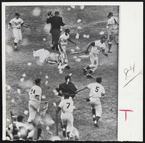 Pandemonium Breaks Loose at the Coliseum yesterday as the Dodgers defeated the Braves 6-5 to cop the National League flag. They are shown charging Gil Hodges, right center, as he crosses plate with winning run. In foreground are Manager Walt Alston (24), Coach Charlie Dressen (7) and Outfielder Norm Larker (5). In background are, left to right, Dodger bat boy, Shortstop Maury Wills, Hodges and Braves Catcher Del Crandall.