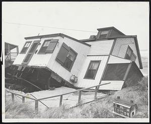 House Built On Sand was toppled yesterday by heavy surf at Plum Island. The cottage is owned by Mrs. Mary Ryan, 4 Grant street, Haverhill.
