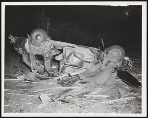 This Car was parked on West Boylston St., Worcester, before the tornado arrived. The twister, worst in New England history, hurled it 50 feet through the air on the campus of Assumption College.