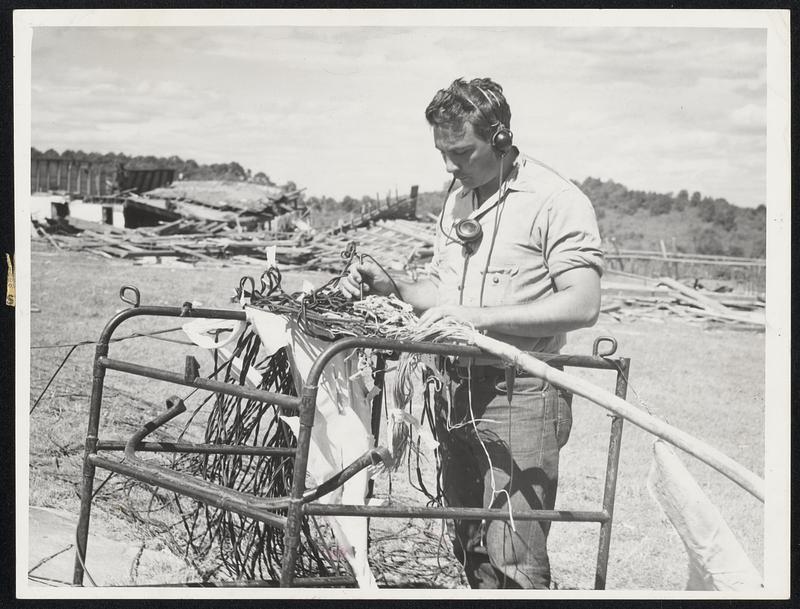 56 different lines from Shrewsbury to Worcester all in one cable. John McCormick of Springfield. Cable splicer with N.E. Tel. + Tel. Photo taken on Grafton St. Shrewsbury.