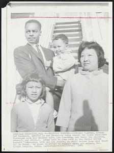 Turncoat Returns--Clarence C. Adams, Korean War turncoat, arrived in San Francisco today aboard the liner President Cleveland with his Chinese wife, Lui Lin-Feng, and their two children, Louis, 3, and Della, 7. Adams said he came back to the United States because "democracy, with all its faults, is still better than what there is" in China. He plans to return to Memphis where his mother, Mrs. Gladys Peoples, lives.