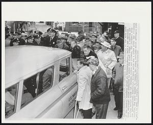 Strikers Halt Car--Pickets at the main gate of the General Electric plant at Fitchburg, Mass., halt a car carrying Navy personnel which attempted to enter the plant today. A pushing and shoving battle broke out between police and pickets. The strikers from the International Electrical Workers union won a truce after the 15-minute scuffle. The Navy wanted to remove two steam turbines which officials said were in need of repair.
