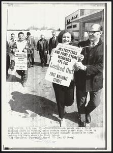 Togetherness--On parade near a First National Store in Warwick, union workers share picket sign. Strike by meatcutters union against Almacs brought complete lockouts by three of the big chain stores in Rhode Island.