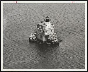 Water, Water Everywhere - Sabin Point Light, operated by two Coast Guardsmen, is on edge of a school in Providence river. Built in 1872, its light shines 12 miles. Coast Guardsmen see brighter lights every 24 days, when they get six-day leave.