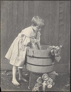 Child washing clothes