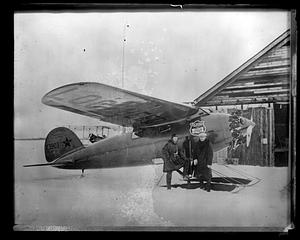 Hubert Wilkins with Ben Eielson, standing beside Lockheed airplane