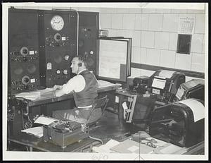 Weather Pacts fromm all over the nation, and in some cases from beyond this nation, pour into this communications center at Boston's new weather forecasting unit that meteorologists may use them in predicting local weather conditions. George J. Gosnell, above, is in charge of this important work.