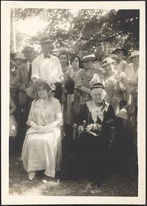 Two costumed women seated