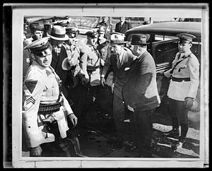 Bruno Richard Hauptmann exiting car, surrounded by police