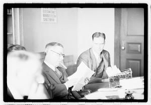 Group of men at table