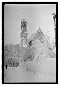 Snow covered street and building