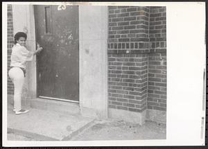Nodi and her front door at Newtowne Court
