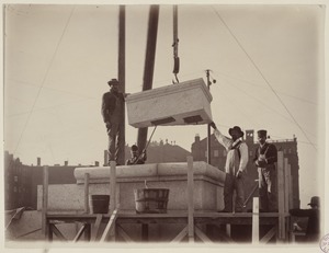Workmen laying the cornerstone, construction of the McKim Building