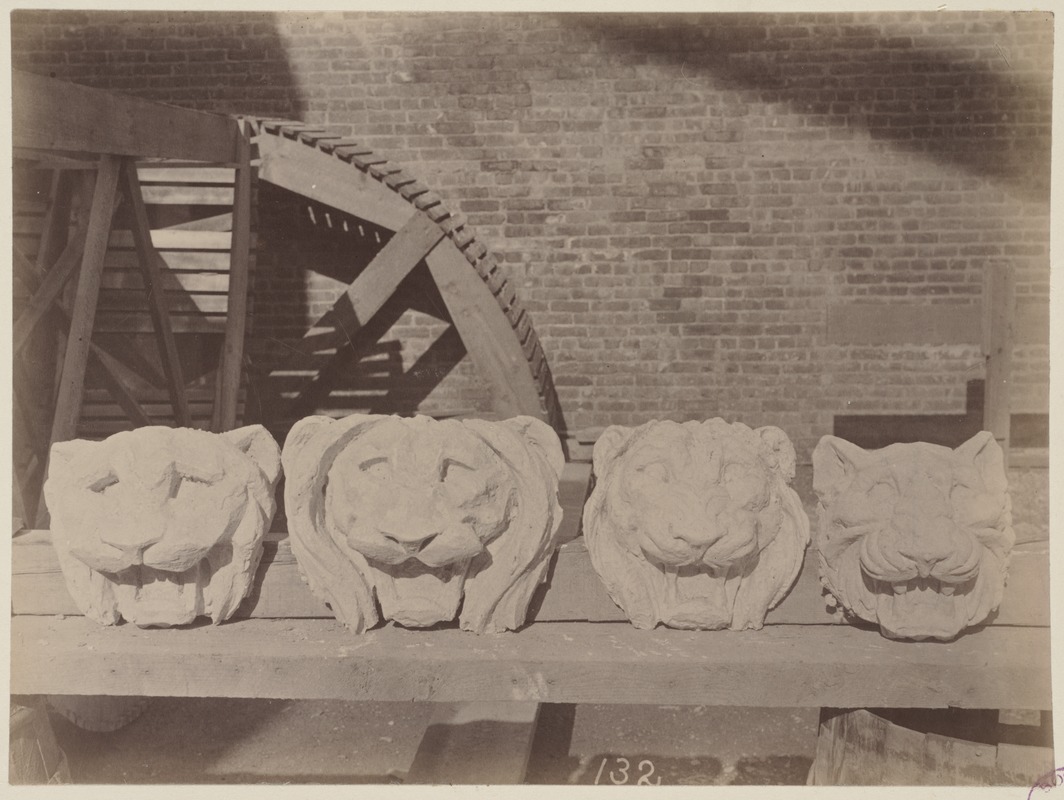 Plaster models of lion's heads for trial cornice, construction of the McKim Building
