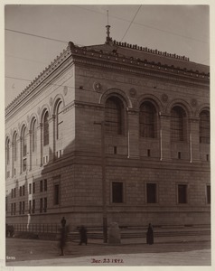 Southeast corner of Facade, showing arched second floor windows and cheneaux details, construction of the McKim Building
