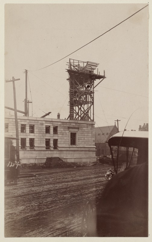 Mock-up of cornice on scaffolding, construction of the McKim Building.