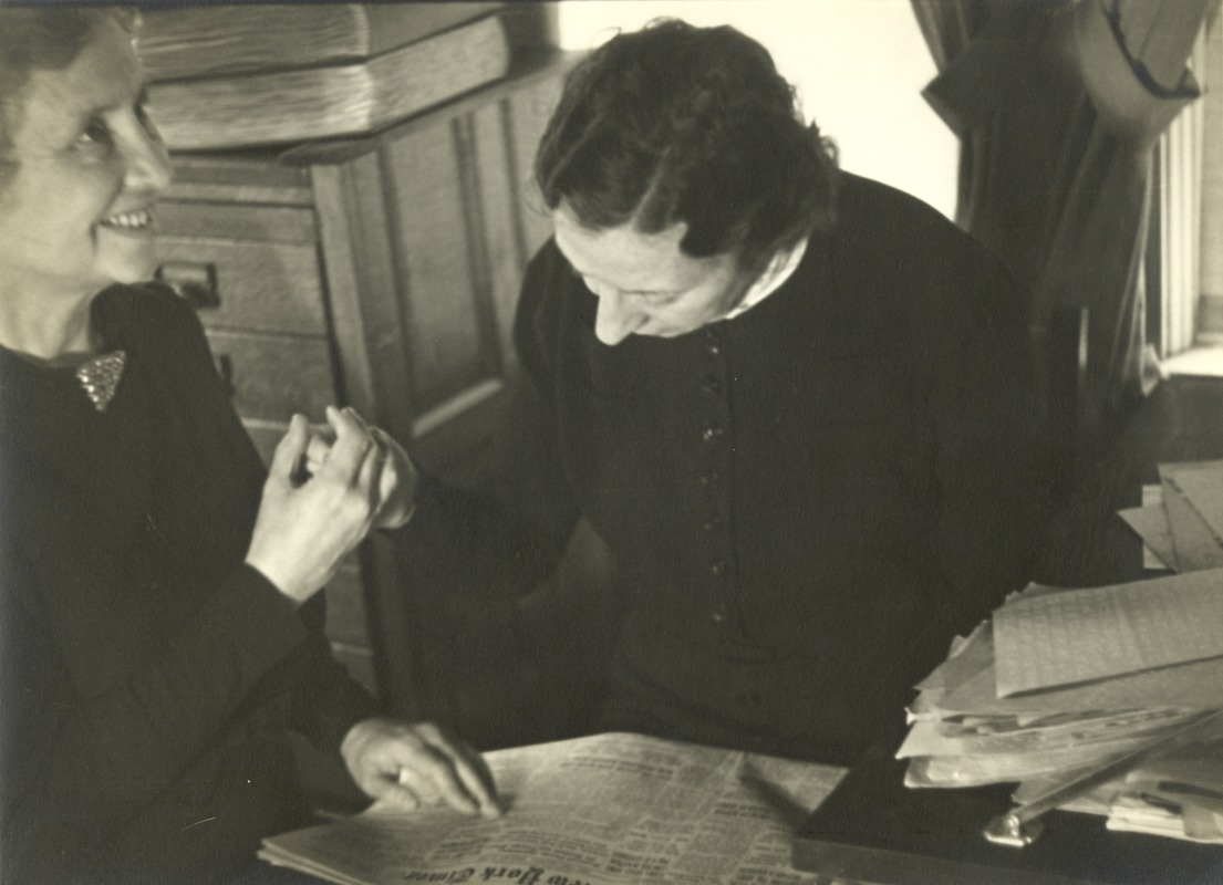 Helen Keller and Polly Thomson Reading a Newspaper