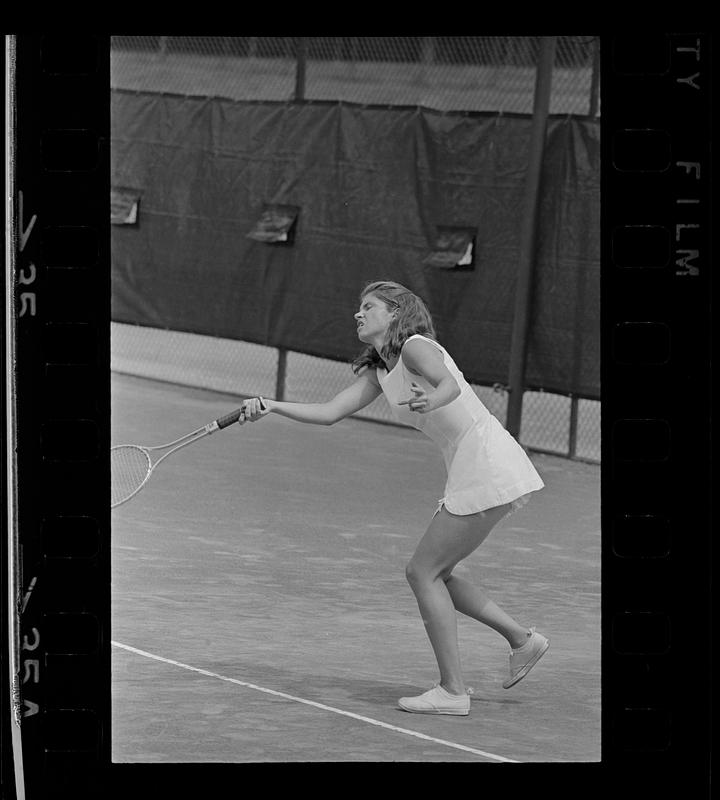 "Baba" Lewis hits a tennis ball, Newton