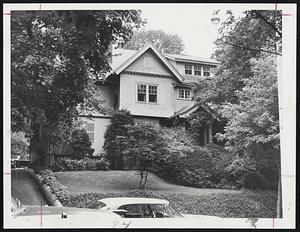New Home of new millionaire Charles W. Abbott, at 88 Mason Terrace, Brookline. He will inherit $1,291,500 from Mrs. Edward Kimball, who died June 2. Abbott, 67, is a widower and retired two years ago on a Social Security pension. He had worked for Mrs. Kimball and her late husband for 50 years as a personal secretary. The Brookline home is part of her estate.