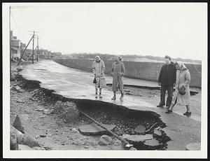 Sea Wall Failed to protect Glades Road, Scituate, where macadam pavement was so battered that underground pipe was exposed.