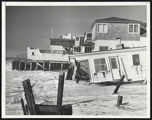 Thundering Tides Crush Ocean Front Homes In its fourth day of battering Southern California's coastline, a Pacific which belied its name tore beach hones to bits and flooded low-lying areas with acres of debris-laden brine.-----Photo Shows: A home in Long beach, California battered to pieces by the high tides and heavy seas that have pounded the Southland's shoreline from Santa Barbara all the way to San Diego.