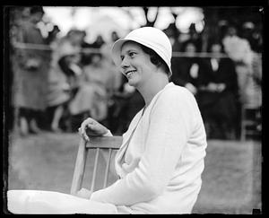 Unidentified seated woman wearing a hat