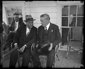 Franklin Delano Roosevelt seated next to James M. Curley