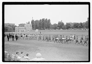 A marching band leading a group