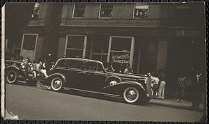 A car in front of Virginia barbershop