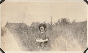 Unidentified woman outside in field