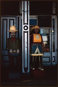 Cigar store figures outside storefront, likely Virginia City, Nevada