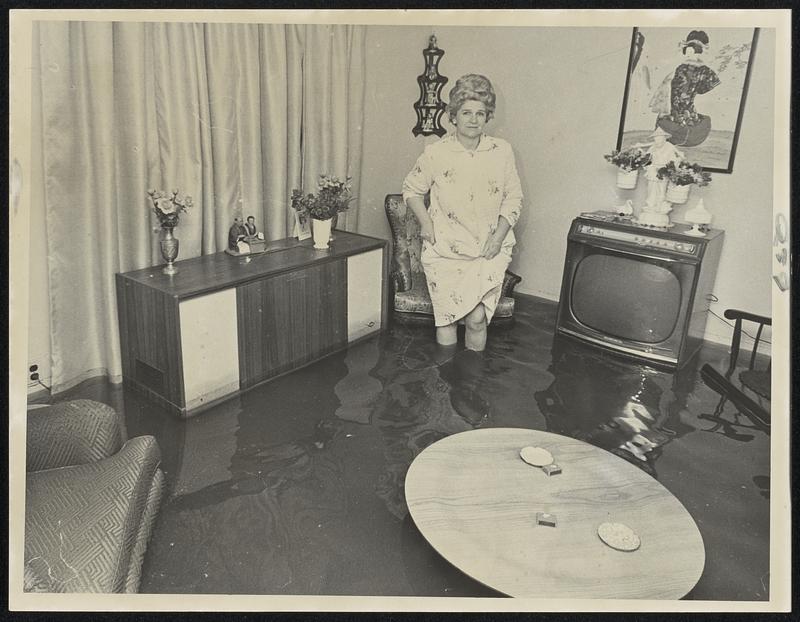 KneeDeep water flooded the basement apartment of Mrs. Ethel Moore, 585
