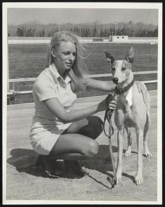 Scenic Raynham - Pretty Joan Pearce, an employee of Raynham Park, holds Cusak Santa, Imp.