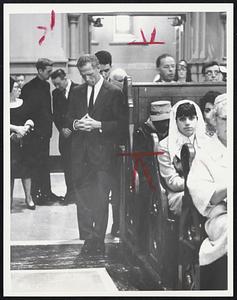 Head Bowed, hands clasped, Mayor Kevin White silently offers his own prayers for Robert F. Kennedy at memorial Mass at Holy Cross Cathedral.