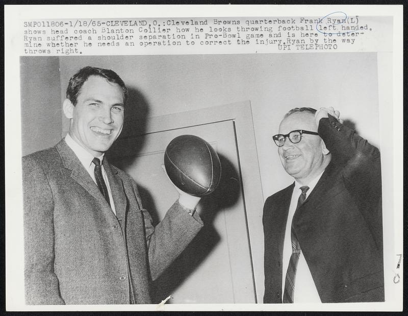 Cleveland Browns quarterback Frank Ryan (L) shows head coach Blanton
