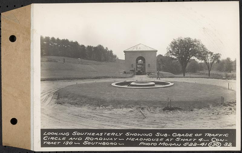 Contract No. 130, Grading, Loaming, and Grassing Vicinity of Shaft 4, Pressure Aqueduct, Southborough, and Improvement of Access Roads to the Intake Works and at Norumbega Reservoir, Marlborough, Southborough, Weston, looking southeasterly showing sub-grade of traffic circle and roadway, headhouse at Shaft 4, Southborough, Mass., May 22, 1941