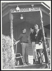 Eighty per cent of the young people who climb the wooden steps of the Open Door Clinic in Seattle use illicit drugs. But all those who come do so to avoid "establishment" hospitals or doctors. On the steps, from left to right, are Al Weese, clinic director, Dr. John Green, board of directors members, and Ron Anderson, clinic worker.